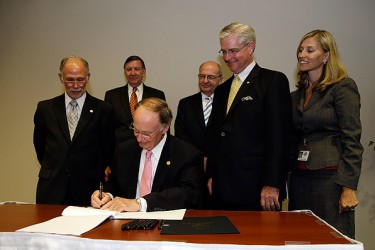 Governor Robert Bentley ceremonially signs Senate Bill 340 during a news conference in Montgomery on Wednesday. Also pictured, from left to right, are Representative Jim McClendon; Mike Horsley, President of the Alabama Hospital Association; Dr. Don Williamson, State Health Officer; Senator Greg Reed and Stephanie Azar, Acting Medicaid Commissioner. Photo credit: Jamie Martin, Governor’s Office.