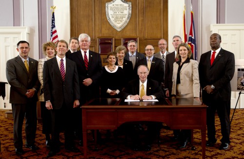 Governor Robert Bentley poses for a photo with  appointed members of the Alabama Executive Veterans Network  (AlaVetNet), a Commission that will address ways to better provide services for Alabama service members and their families at the Alabama State Capitol on Tuesday, Dec. 10, 2013.