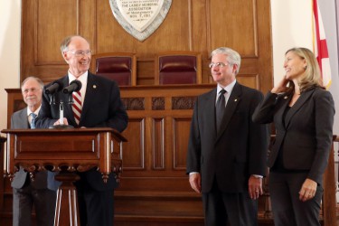 Gov. Robert Bentley announces the Alabama Medicaid Agency's regional care organization plan, to provide medical care to most Alabamians on Medicaid, has been approved by the Centers for Medicare and Medicaid Services (CMS), at the state Capitol in Montgomery, Tuesday, Feb. 9, 2016. Reforming Medicaid by increasing efficiency and improving patient care has been a long-term goal for Governor Bentley. Pictured, from left, state Sen. Jim McClendon, Gov. Bentley, state Sen. Greg Reed and Medicaid Commissioner Stephanie Azar. (Governor's Office, Jamie Martin)