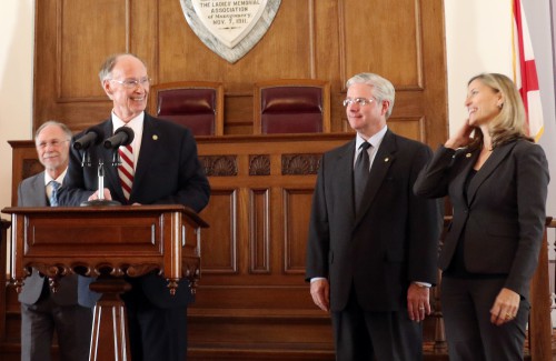 Gov. Robert Bentley announces the Alabama Medicaid Agency's regional care organization plan, to provide medical care to most Alabamians on Medicaid, has been approved by the Centers for Medicare and Medicaid Services (CMS), at the state Capitol in Montgomery, Tuesday, Feb. 9, 2016. Reforming Medicaid by increasing efficiency and improving patient care has been a long-term goal for Governor Bentley. Pictured, from left, state Sen. Jim McClendon, Gov. Bentley, state Sen. Greg Reed and Medicaid Commissioner Stephanie Azar. (Governor's Office, Jamie Martin)