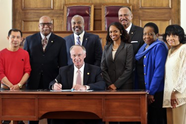 Alabama Gov. Robert Bentley signs an Executive Order creating the Governor's Office of Minority Affairs in the Old House Chamber at the state Capitol in Montgomery, Wednesday, March 9, 2016. The office will be responsible for advising the Governor on issues affecting minorities, including women. The office will focus on the improvement of the overall quality of life of minorities, specifically in the areas of education, health, economics, political participation and empowerment, housing, employment, civil rights, criminal justice and race relations. (Governor's Office, Jamie Martin)