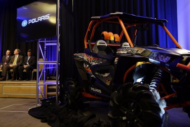 A Polaris Industries, Inc. off road vehicle is parked near the state during an announcement the company will expand production facilities in Huntsville, Ala., Friday, Jan. 9, 2015. At full capacity the site will employ up to 2,000 people. With Gov. Bentley are Polaris Executive Vice President-Global Operations Engineering Ken Pucel, center, and Huntsville Mayor Tommy Battle, right. The new 600,000 square-foot facility will focus on off-road vehicle production and will feature flexible manufacturing capabilities that support Polaris' growth through continuous improvement, commitment and operations. (Governor's Office, Jamie Martin)