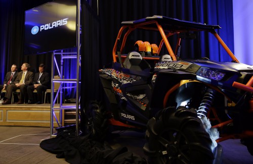 A Polaris Industries, Inc. off road vehicle is parked near the state during an announcement the company will expand production facilities in Huntsville, Ala., Friday, Jan. 9, 2015. At full capacity the site will employ up to 2,000 people. With Gov. Bentley are Polaris Executive Vice President-Global Operations Engineering Ken Pucel, center, and Huntsville Mayor Tommy Battle, right. The new 600,000 square-foot facility will focus on off-road vehicle production and will feature flexible manufacturing capabilities that support Polaris' growth through continuous improvement, commitment and operations. (Governor's Office, Jamie Martin)