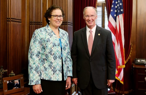 Alabama Gov. Robert Bentley talks with Dana Jacobson, the 2016-2017 Alabama Teacher of the Year, in his office at the state Capitol in Montgomery, Wednesday, May 25, 2016. Jacobson has taught at Clay-Chalkville High School in Jefferson County since 1999. She is known for creating different activities and new avenues for learning to help engage students and teach important values. (Governor's Office, Jamie Martin)